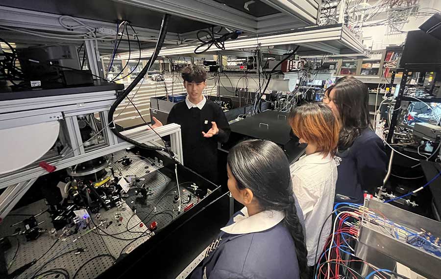 Honours student Grant Chan presents a newly constructed ion trap, engineered to capture a type of ion not previously used in quantum computing research