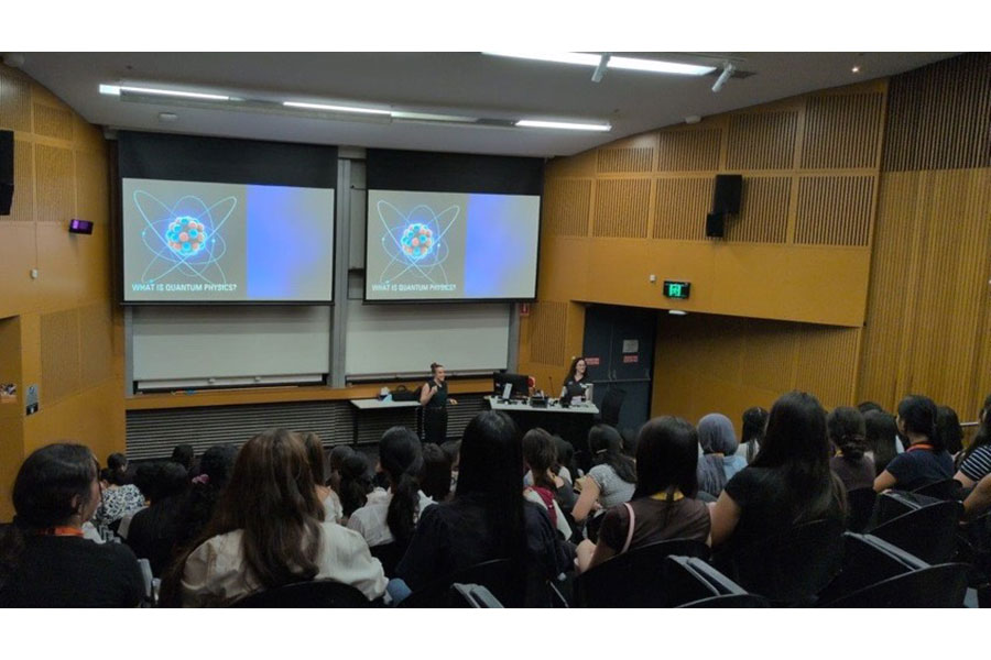 A photo of Dr Xanthe Croot pitching her challenge to an auditorium of year 11 students participating in the Khuda Program.