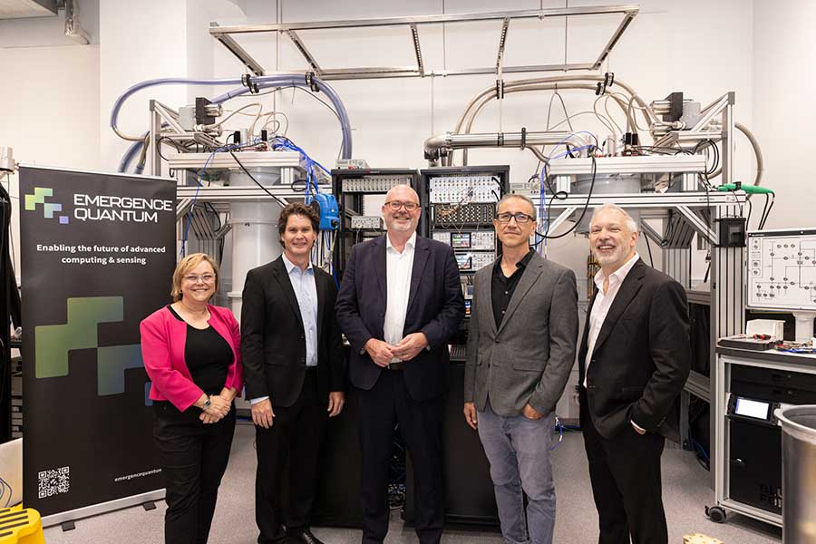 Prof David Reilly, Hon Tim Ayres, Prof Thomas Ohki and Prof Stephen Bartlett posing for a photo in the Quantum Nanoscience Laboratory.